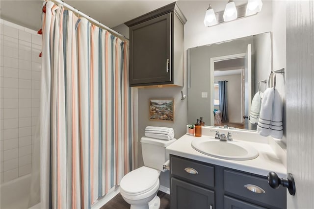 bathroom featuring toilet, vanity, and shower / bath combination with curtain