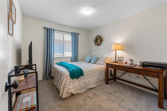 carpeted bedroom with baseboards