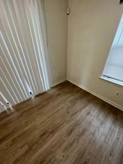 spare room with dark hardwood / wood-style floors