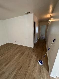 empty room featuring dark hardwood / wood-style flooring