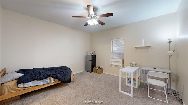 609 Townplace Dr, College Station, TX 77840 - carpeted bedroom with freestanding refrigerator and ceiling fan
