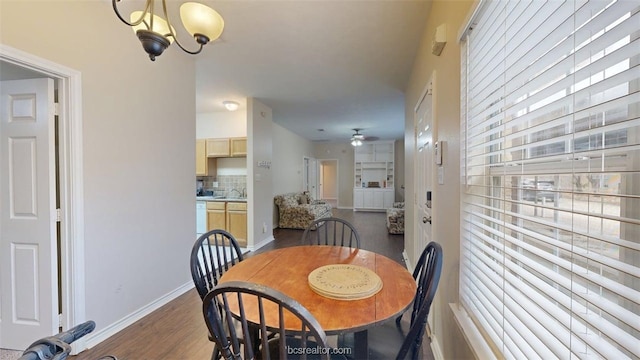609 Townplace Dr, College Station, TX 77840 - dining space featuring dark wood finished floors, a chandelier, and ceiling fan