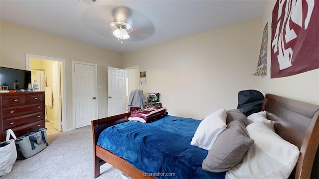 609 Townplace Dr, College Station, TX 77840 - carpeted bedroom with connected bathroom and ceiling fan