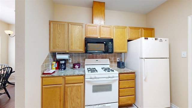 609 Townplace Dr, College Station, TX 77840 - kitchen with white appliances, tasteful backsplash, light brown cabinetry, and light wood-style floors