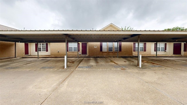 609 Townplace Dr, College Station, TX 77840 - view of front facade with covered parking and brick siding