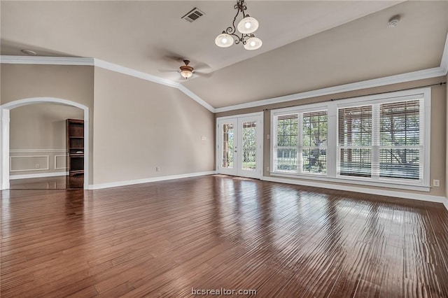 unfurnished living room with ceiling fan with notable chandelier, dark hardwood / wood-style flooring, crown molding, and lofted ceiling