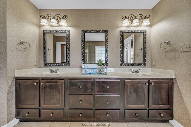 bathroom with vanity and tile patterned floors