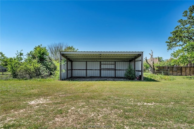 view of outbuilding with a lawn