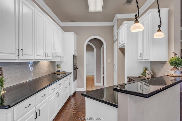 kitchen with white cabinetry, hanging light fixtures, dark wood-type flooring, and black appliances