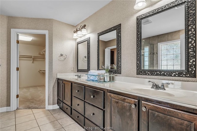 bathroom with tile patterned flooring and vanity