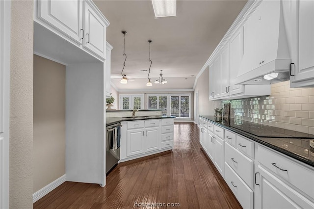 kitchen featuring white cabinetry, sink, dark hardwood / wood-style flooring, stainless steel dishwasher, and premium range hood