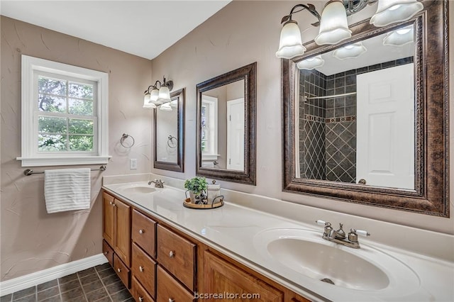 bathroom with vanity and tiled shower