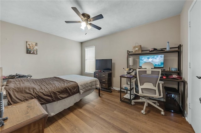 bedroom featuring ceiling fan and hardwood / wood-style floors