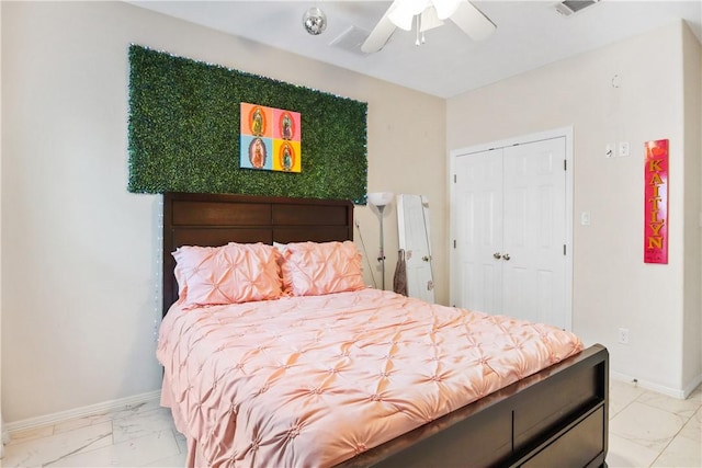 bedroom with ceiling fan and a closet