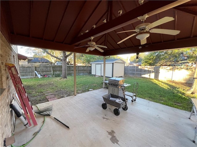 view of patio / terrace with ceiling fan and a storage shed