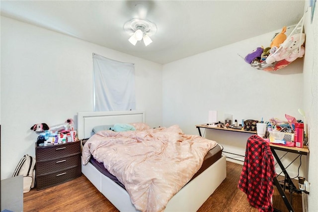 bedroom with wood finished floors