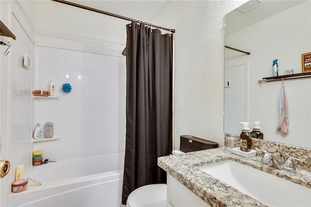 bathroom with vanity, toilet, and shower / bath combo with shower curtain