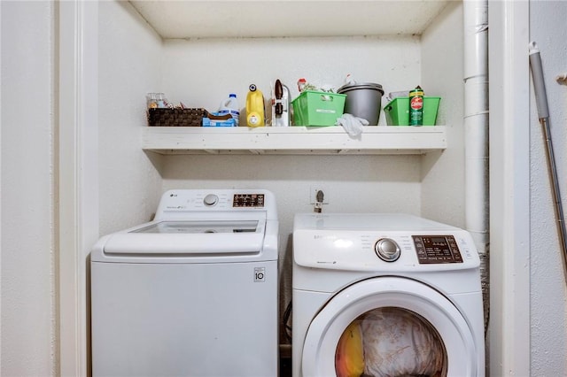 laundry room with washer and dryer and laundry area