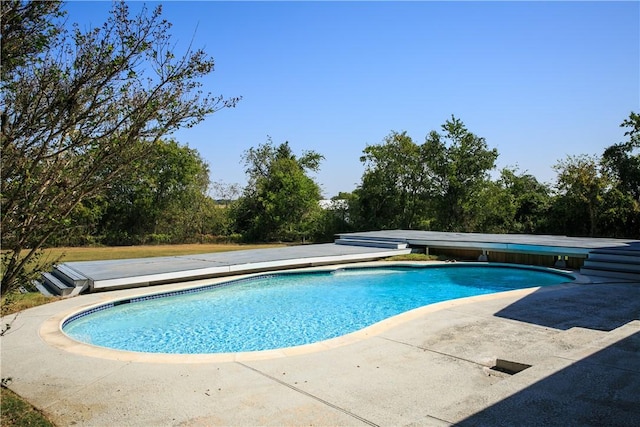 view of pool featuring a patio area