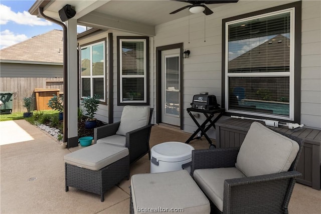 view of patio featuring outdoor lounge area, ceiling fan, and a grill