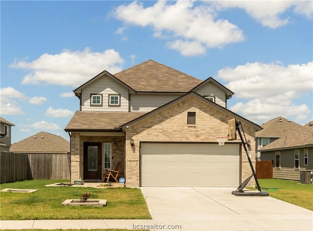 view of front of home featuring a front yard and a garage