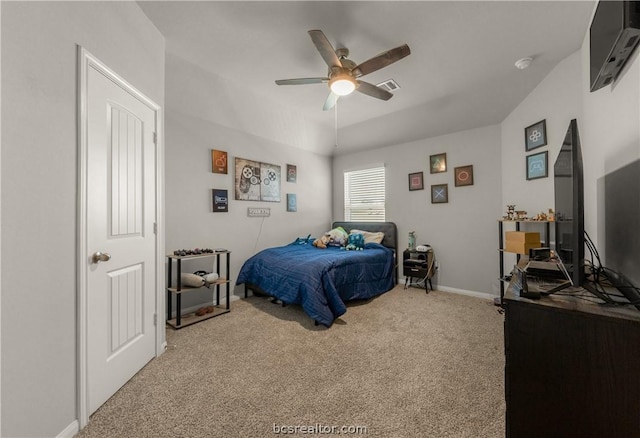 bedroom with carpet, ceiling fan, and an AC wall unit