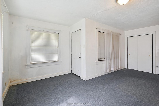 unfurnished bedroom with a textured ceiling