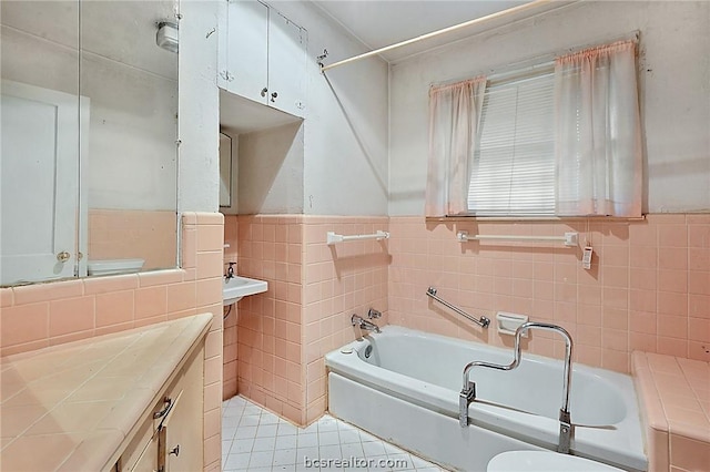 bathroom featuring tile patterned flooring and tile walls