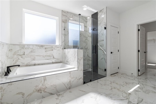 bathroom with a garden tub, marble finish floor, a closet, and a marble finish shower