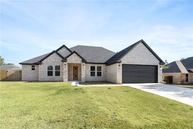 french country home with an attached garage, brick siding, fence, driveway, and a front yard