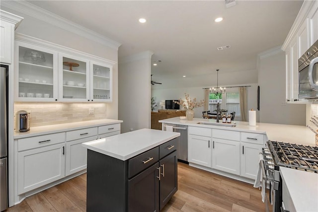 kitchen with a sink, white cabinetry, and appliances with stainless steel finishes