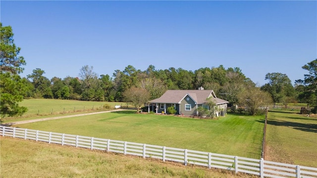 farmhouse inspired home with a rural view and a front yard