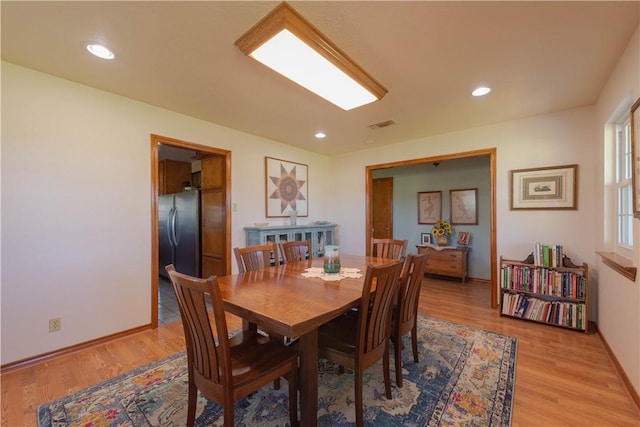 dining room with light wood-type flooring