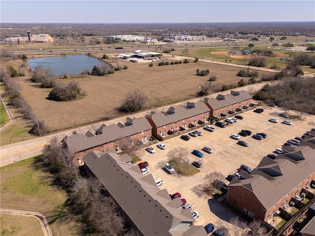 aerial view with a water view and a residential view