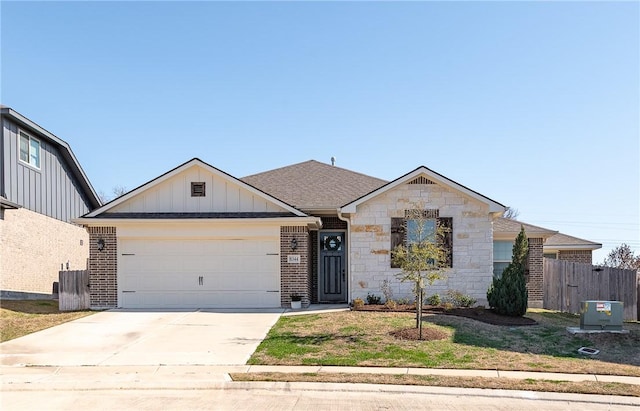 view of front facade featuring a garage, driveway, fence, board and batten siding, and brick siding