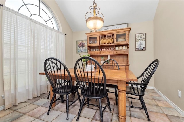 dining room with vaulted ceiling