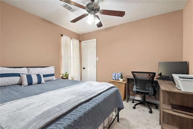 bedroom featuring ceiling fan and light carpet