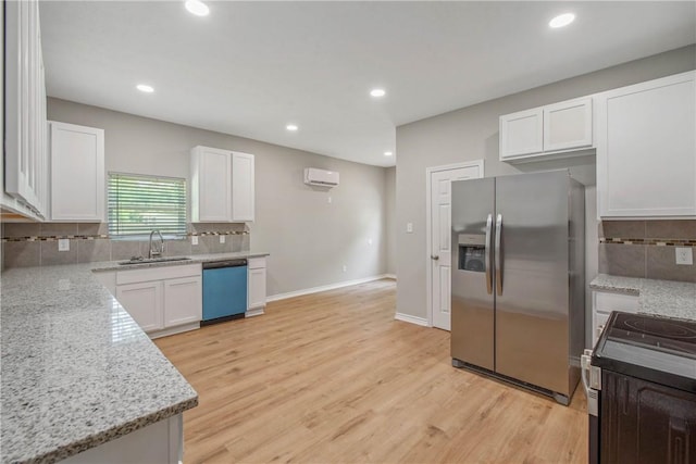 808 N Washington Ave, Bryan, TX 77803 - kitchen with stainless steel fridge, dishwasher, a sink, a wall unit AC, and tasteful backsplash