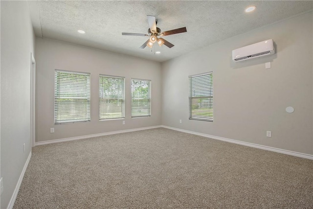 808 N Washington Ave, Bryan, TX 77803 - unfurnished room featuring an AC wall unit, a textured ceiling, ceiling fan, carpet flooring, and recessed lighting