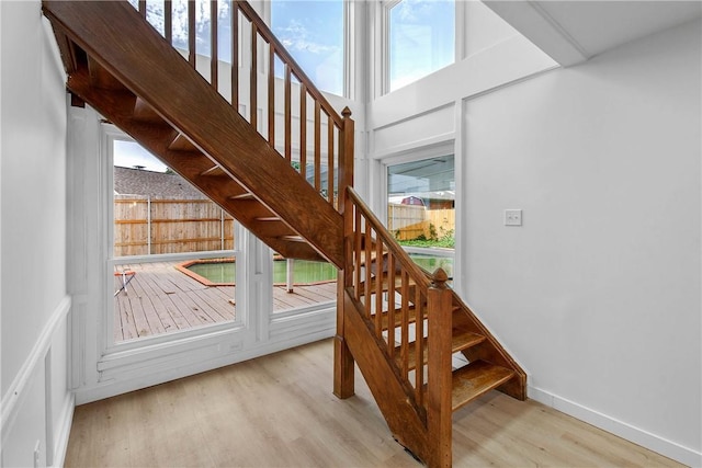 2430 E Briargate Dr, Bryan, TX 77802 - stairway featuring wood finished floors and baseboards