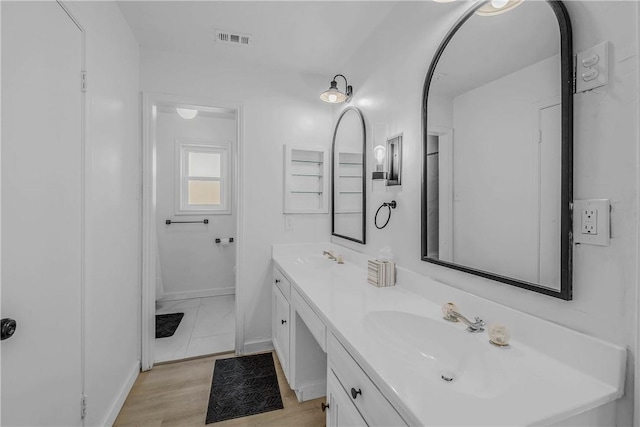 2430 E Briargate Dr, Bryan, TX 77802 - full bathroom featuring double vanity and baseboards