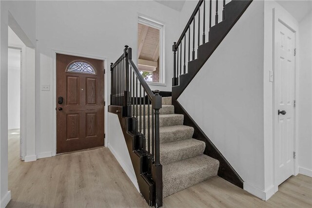 2430 E Briargate Dr, Bryan, TX 77802 - foyer with wood finished floors, stairway, and baseboards
