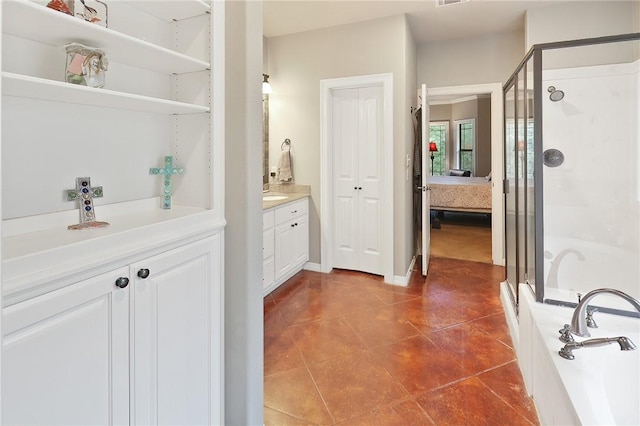 bathroom featuring tile patterned floors, vanity, and independent shower and bath