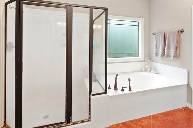 bathroom featuring separate shower and tub and tile patterned floors