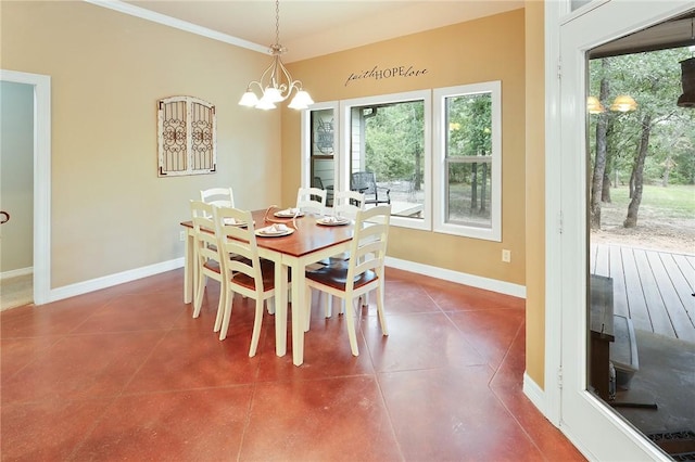 tiled dining area featuring a chandelier and ornamental molding