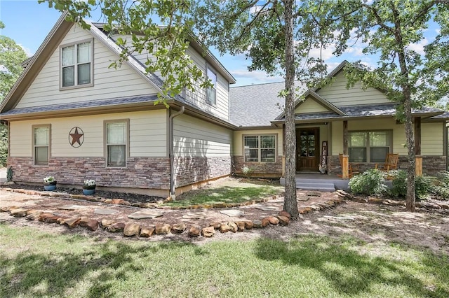 view of front of home with a front lawn and covered porch