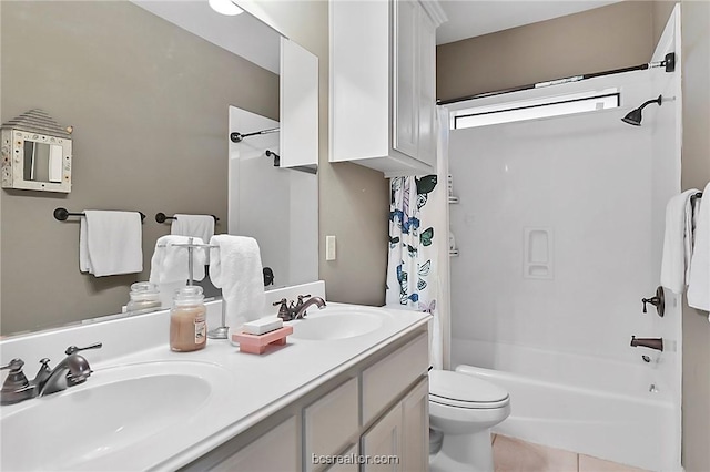 full bathroom featuring vanity, toilet, and shower / bath combination