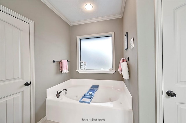 bathroom with a washtub and ornamental molding