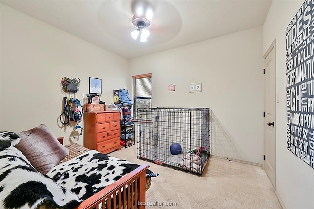 bedroom with ceiling fan and light colored carpet