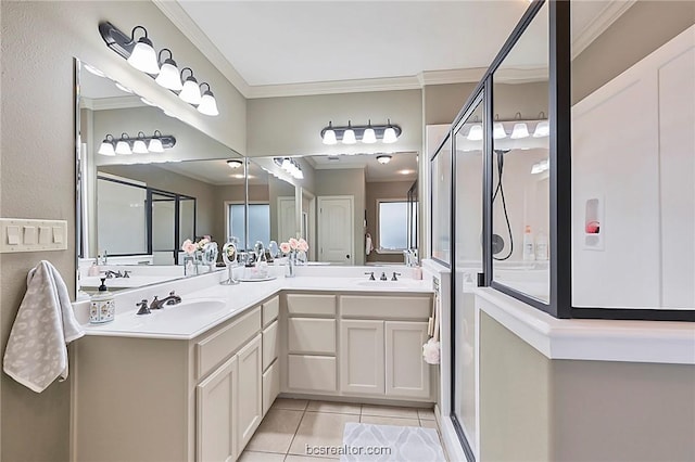 bathroom with tile patterned flooring, vanity, a shower with door, and crown molding